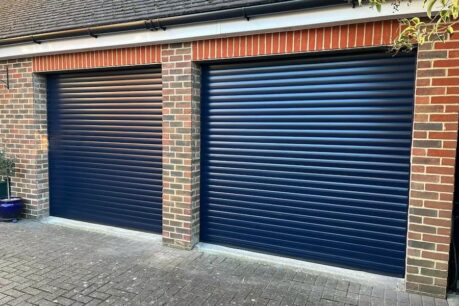 A sleek, automated roller garage door in a striking blue aluminium finish, ideal for modern homes.