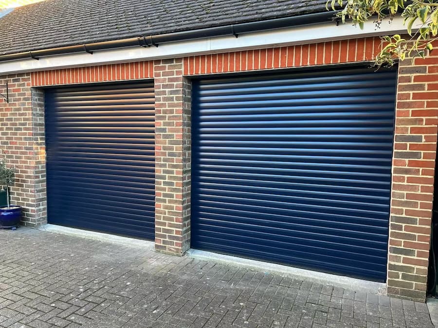 A sleek, automated roller garage door in a striking blue aluminium finish, ideal for modern homes.