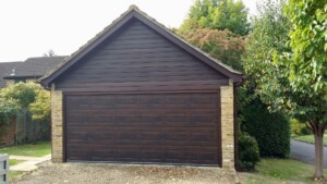 Wood effect coloured sectional garage door