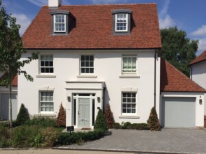 White House with Verwood Agate Grey Garage Door